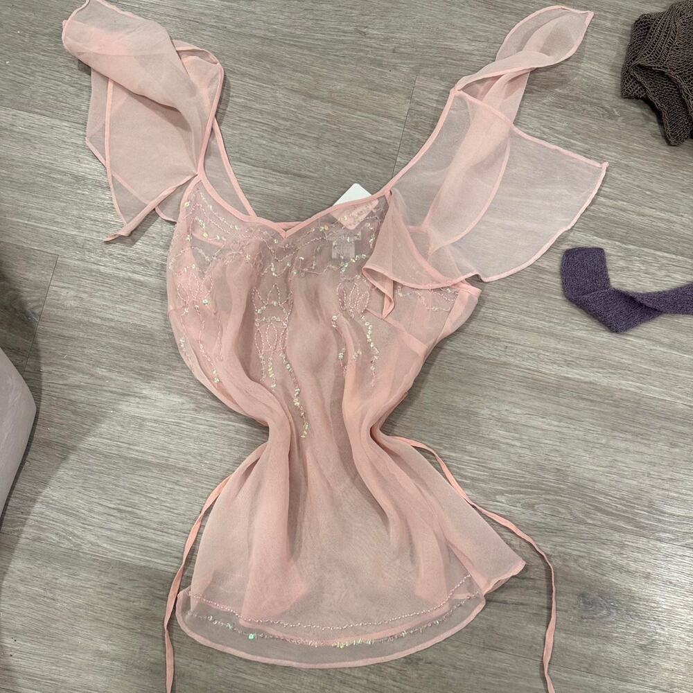 sheer blush pink mesh top with sparkly embroidery + dramatic ruffle strap